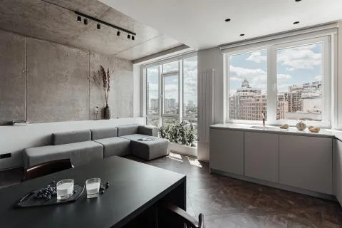 Bright kitchen with dark table, convenient location of kitchen accessories and Фото