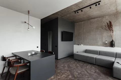 Bright kitchen with dark table, convenient location of kitchen accessories and Stock Photos