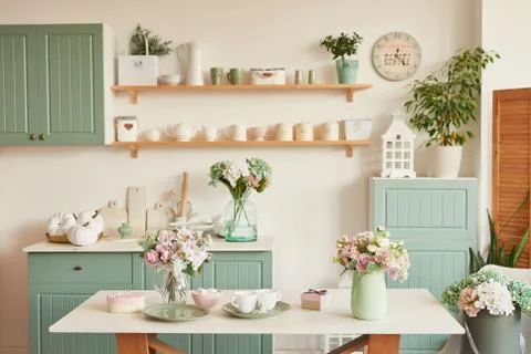 Bright kitchen in the style of Provence, on the table dishes and a bouquet of Stock Photos