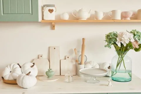 Bright kitchen in the style of Provence, on the table dishes and a bouquet of Stock Photos