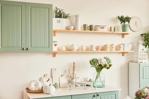 Bright kitchen in the style of Provence, on the table dishes and a bouquet of Stock Photos