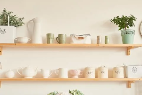 Bright kitchen in the style of Provence, on the table dishes and a bouquet of Stock Photos
