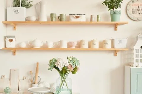 Bright kitchen in the style of Provence, on the table dishes and a bouquet of Stock Photos