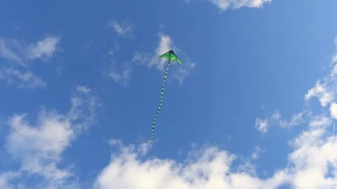 A bright kite soaring high across a breezy sky, drifting with the wind Stock Footage 330601781