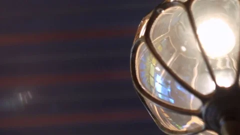 Bright lamp light from the flashlight. Close-up of a vintage lamp Stock Footage 77575083