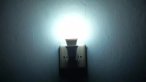 Bright LED lamp switched on by hand, Stock Footage 340876553