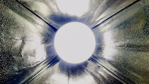 Bright led light tunnel interior with reflective textured metal walls creating f Stock Footage 327729454