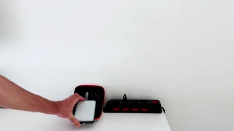 Bright LED Work Light on Table Illuminates Wall with Power Strip Behind Stock-Footage 314707017