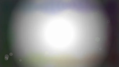 Bright Lens Flare Effect with Bokeh and Light Streaks - Abstract Background Stock Footage 346661868