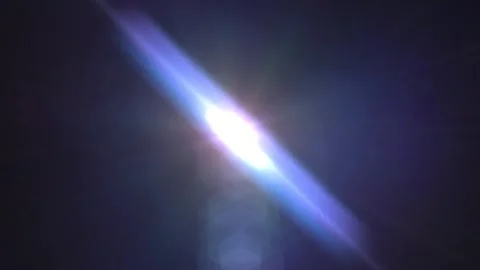 Bright Lens Flare Effect with Dark Background Stock Footage 340528773