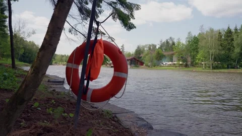 Bright Lifebuoy on Lakeside Path 스톡 동영상 311892926