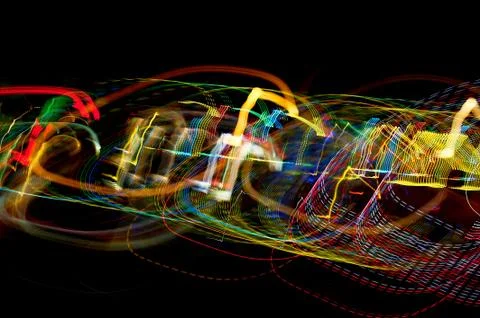 Bright light blurred rays on dark background. colors Foto stock