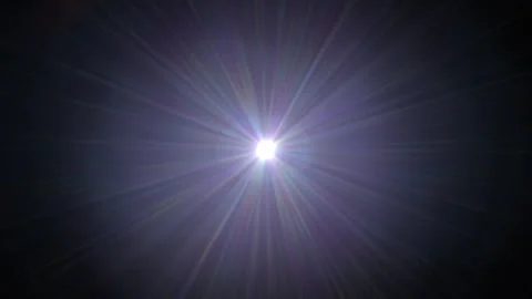 Bright Light Burst with Radiating Beams Against Dark Background Stock Footage 338301850