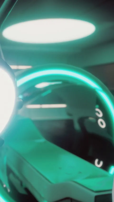 Bright light circle in a modern workspace with green illumination at night Stock Footage 334172864