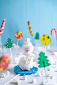 A bright light composition of multi-colored lollipops. Snowman, New Year Stock Photos