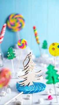 A bright light composition of multi-colored lollipops. alarm clock, New Year, Stock Photos