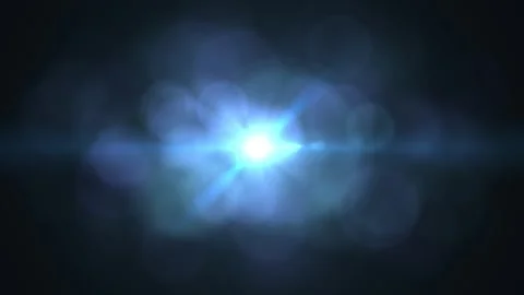 Bright Light Flare Effect Against a Dark Background with Lens Glare and Bokeh 動画素材 337955625