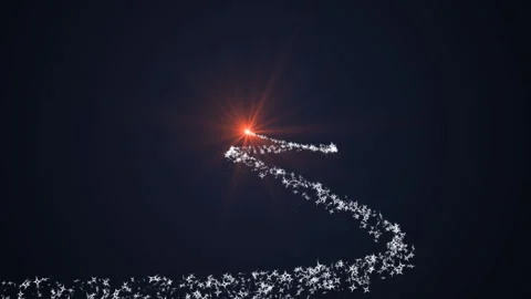 Bright light flying through space draws a Christmas tree with a trail of sno Stock-Footage 294168734