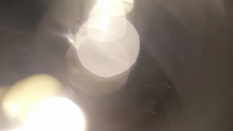 Bright light glow with rays and bokeh on the background of abstract animation Stock Footage 242162820