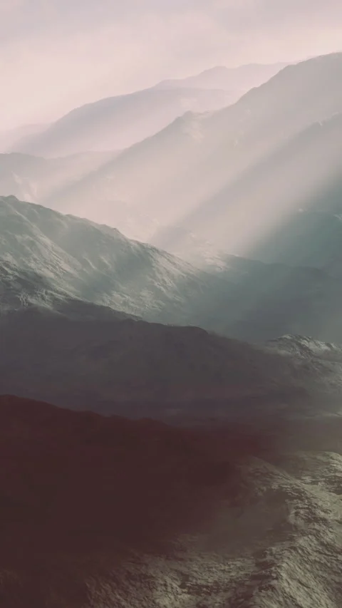 Bright light illuminates mountains and hills during early morning hours Stock Footage 333568039