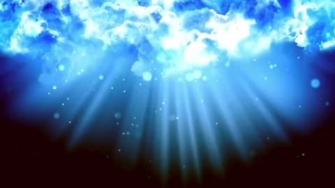 Bright light rays shining through fluffy blue clouds in a dark sky with Stock Footage 338440625