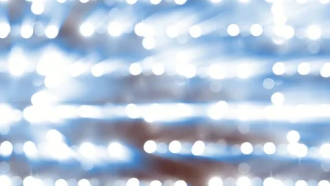 Bright light reflections on a blurred background with blue and white hues Stock Footage 327138772