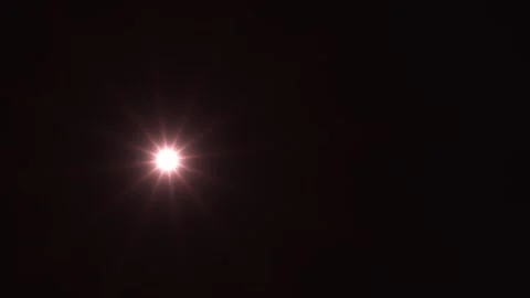 Bright light shining against a dark background at night Stock Footage 338228252