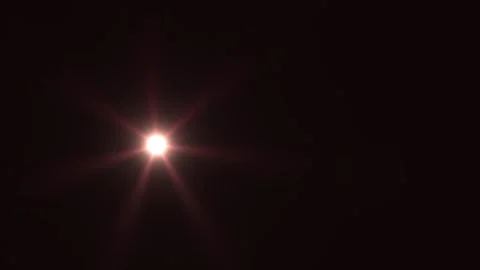 Bright light shining in a dark space with star-like effect Stock Footage 338989088