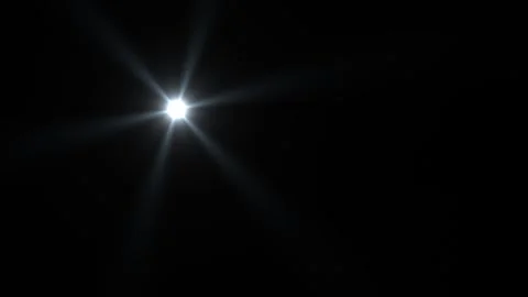 Bright light shining through darkness creating star effect Stock Footage 338292792