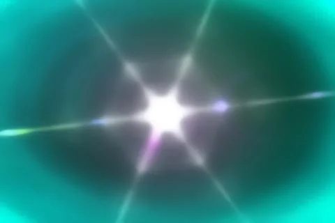 Bright light shining with turquoise background and colorful lens flare Stock Photos