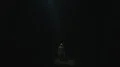 The bright light from a sky shines on a man in the dark 4k or 4k+ Resolution