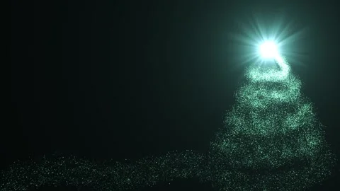 A bright light source draws a Christmas tree made of green particles on a Stock Footage 256321986