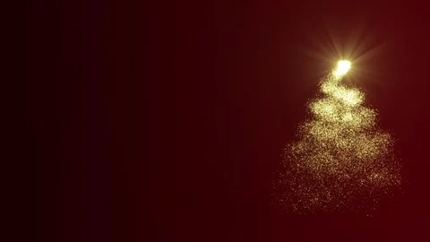 A bright light source draws a Christmas tree made of golden particles on a Stock Footage 256745018