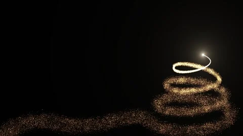 A bright light source draws a Christmas tree made of golden particles on a dark Stock Footage 258013572