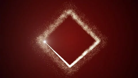 Bright light source draws a square frame of golden particles on a gradient red Stock Footage 258012920