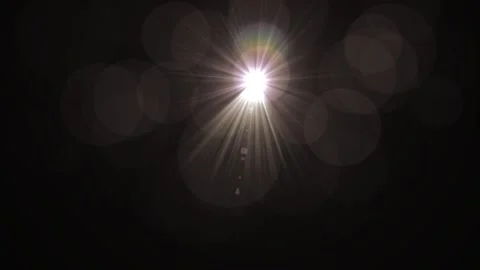 Bright Light Source with Lens Flare and Bokeh Effect in Darkness Stock Footage 345420022