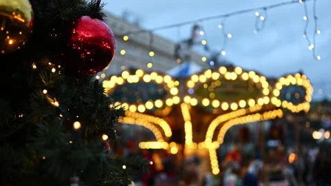 Bright Lighting Carousel Merry-Go-Round Rotating On A Christmas Market Stock-Footage 341573446