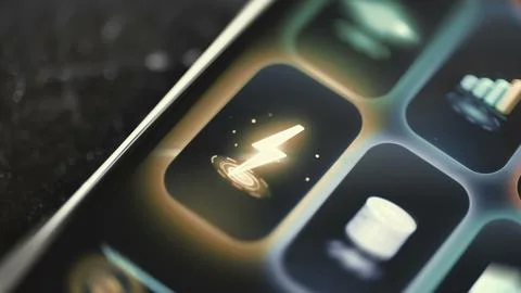 Bright lightning symbol dominates a technology control tile Stockfoto's
