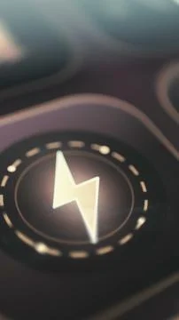 Bright lightning symbol inside a circular control represents electrical Stock Photos