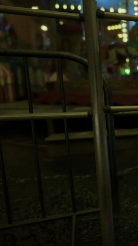 Bright lights and distant laughter fill the empty carnival night Stock Footage 340078171
