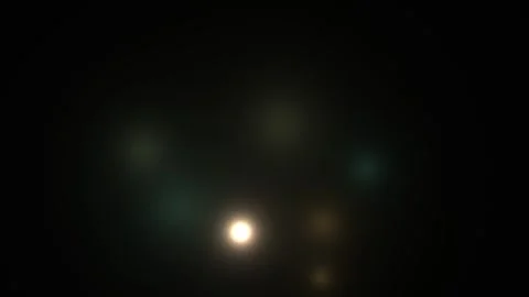 Bright lights dance in dark background creating unique Stock Footage 338317893