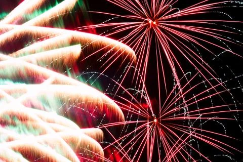 Bright lights of firework in dark night sky. Stock Photos