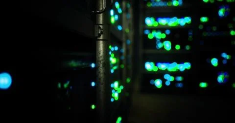 Bright lights illuminate server racks in a data center during nighttime イラスト素材