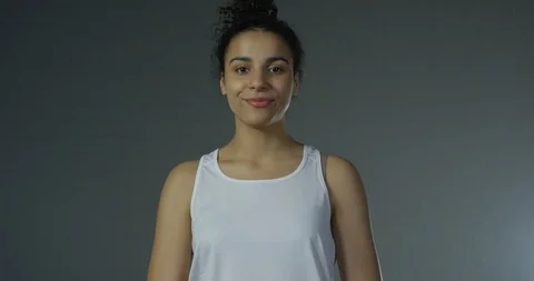 Bright Lights On Portrait Of Athletic Mixed Race Beautiful Female Model Smiling Stock Footage 112761060