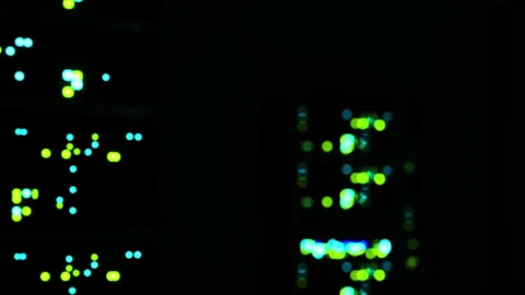 Bright lights from server racks in a dark room during nighttime work Stock Footage 345007442