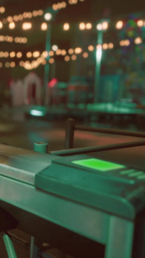 Bright lights shine in the background while a machine prepares for an event Stock Footage 339783621