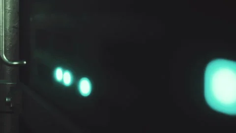 Bright lights shine in a dark room with modern technology visible nearby Stock Footage 345003575