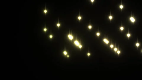 Bright lights shining against a dark background in a Stock Footage 338236995