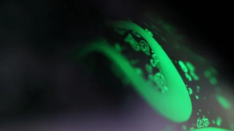 Bright liquid reflection in the darkness, macro view Stock Footage 298708394