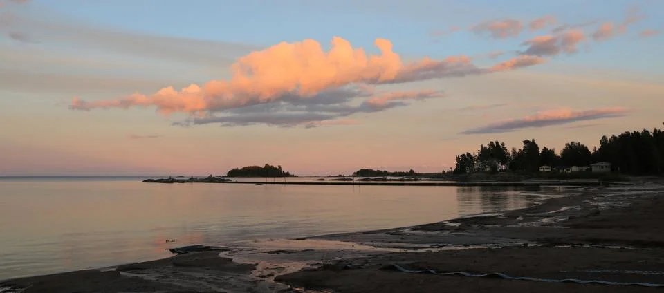Bright lit cloud over Lake Vanern, Sweden. Stock Photos